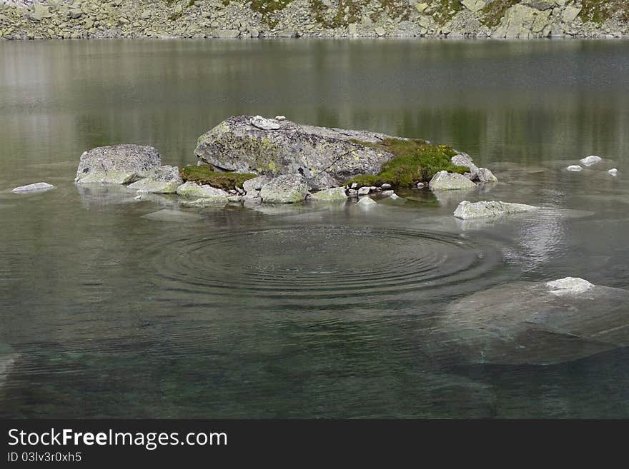 Rock in mountain lake