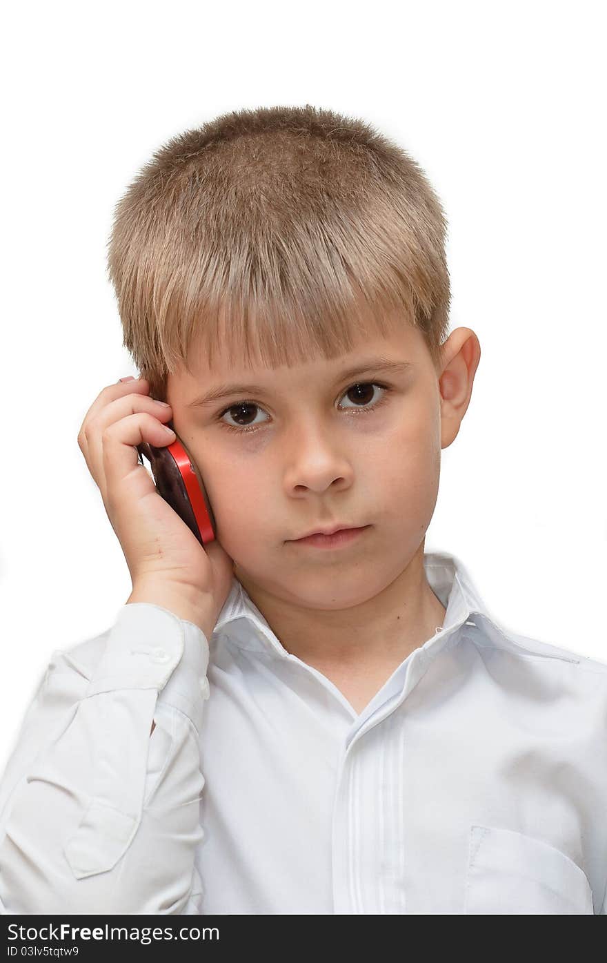 A boy with a cell phone. Isolated on white background