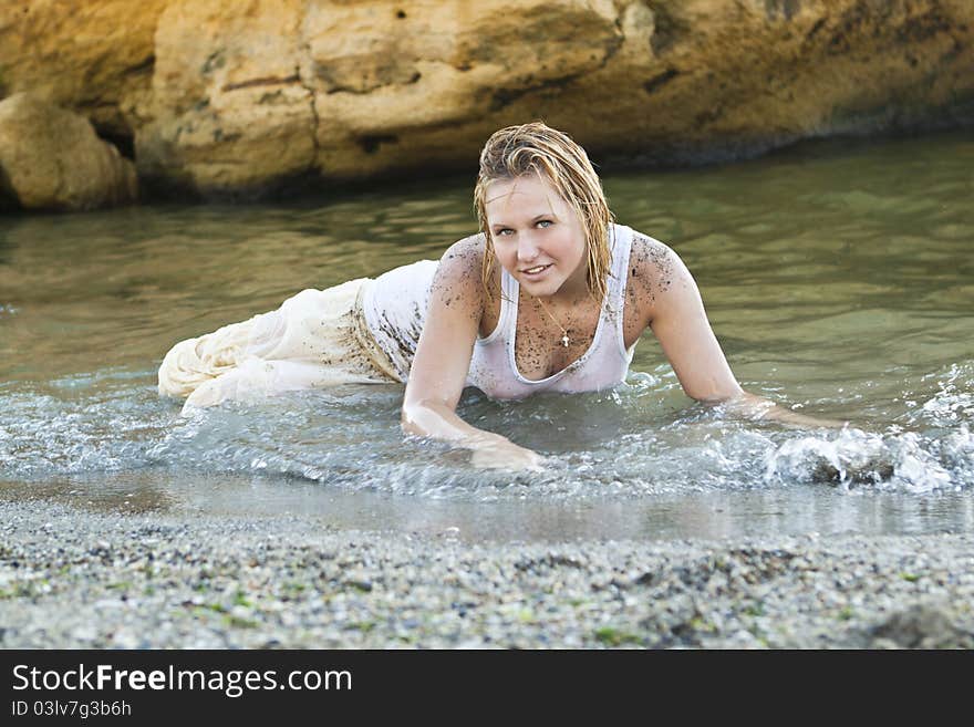 Redheaded girl in a wet white T-shirt