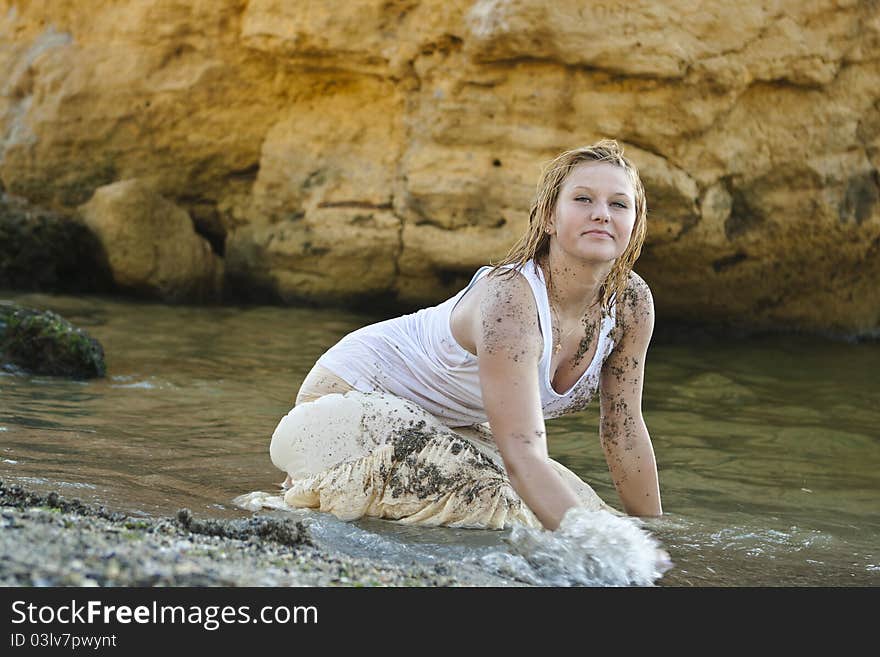 Redheaded girl in a wet white T-shirt