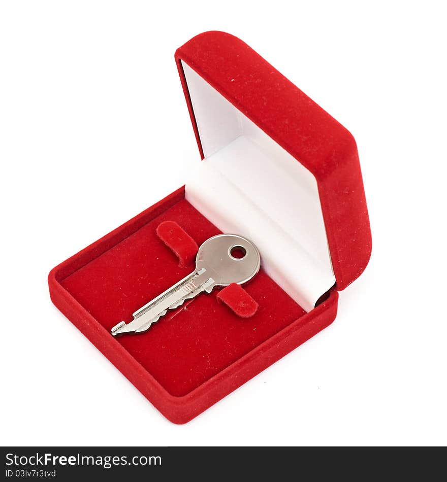 Keys in red gift box isolated on white