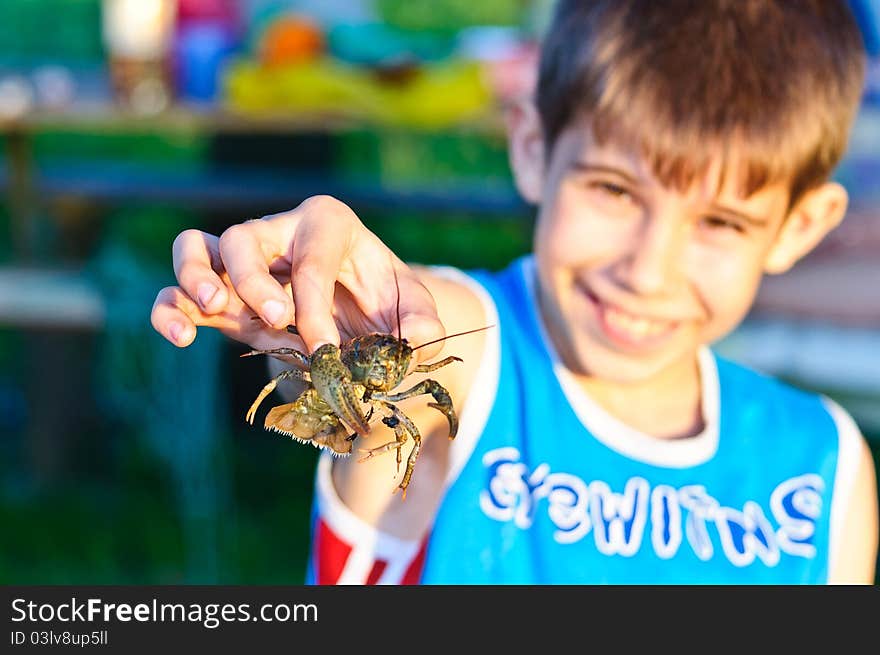 Little boy holding a small cancer