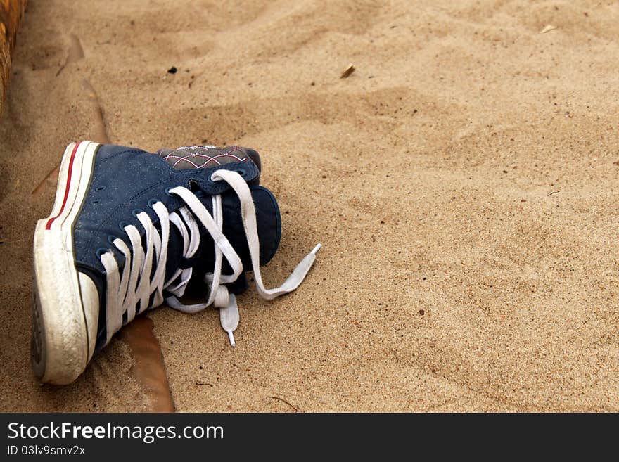 A Sneaker In The Sand