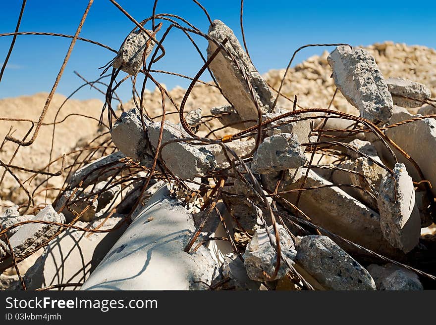 Ruined concrete pillar with rusty wires. Ruined concrete pillar with rusty wires