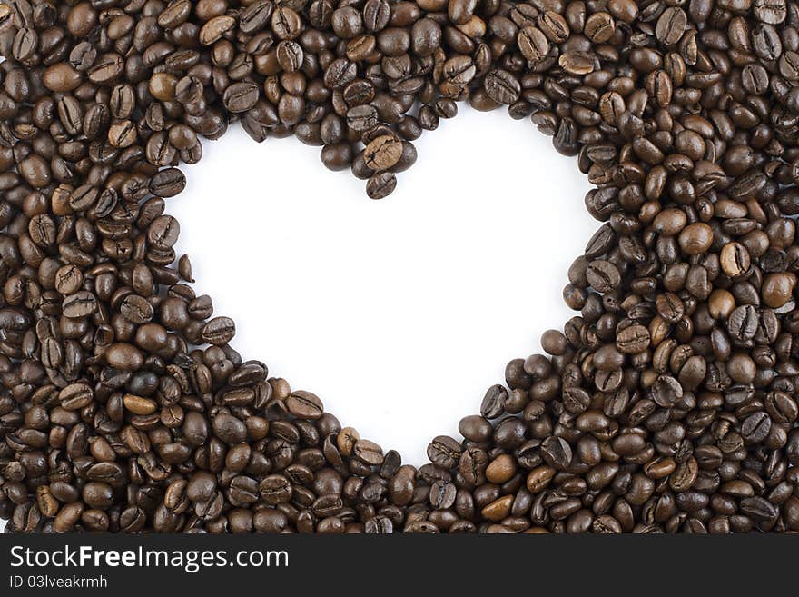 Coffee beans forming shape of heart. Coffee beans forming shape of heart