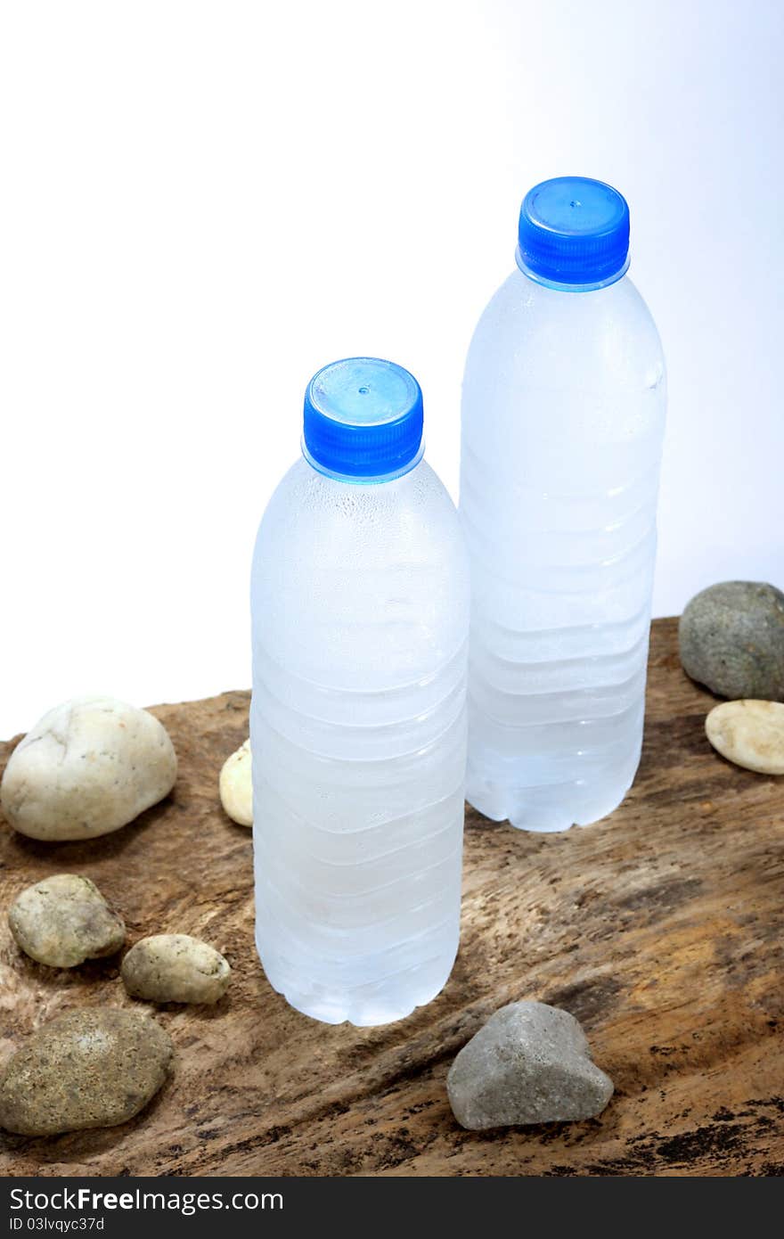 Cold water bottles on wood