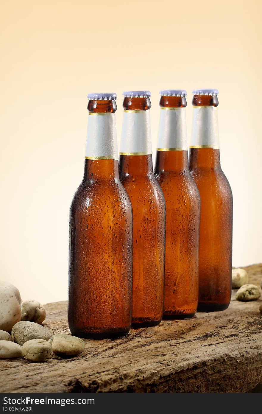 Four Cold Beer Bottles orange gradient background