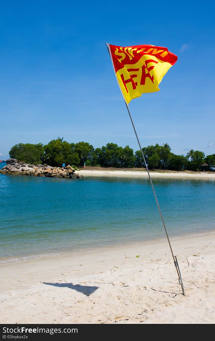 Swim Here Flag on Beach