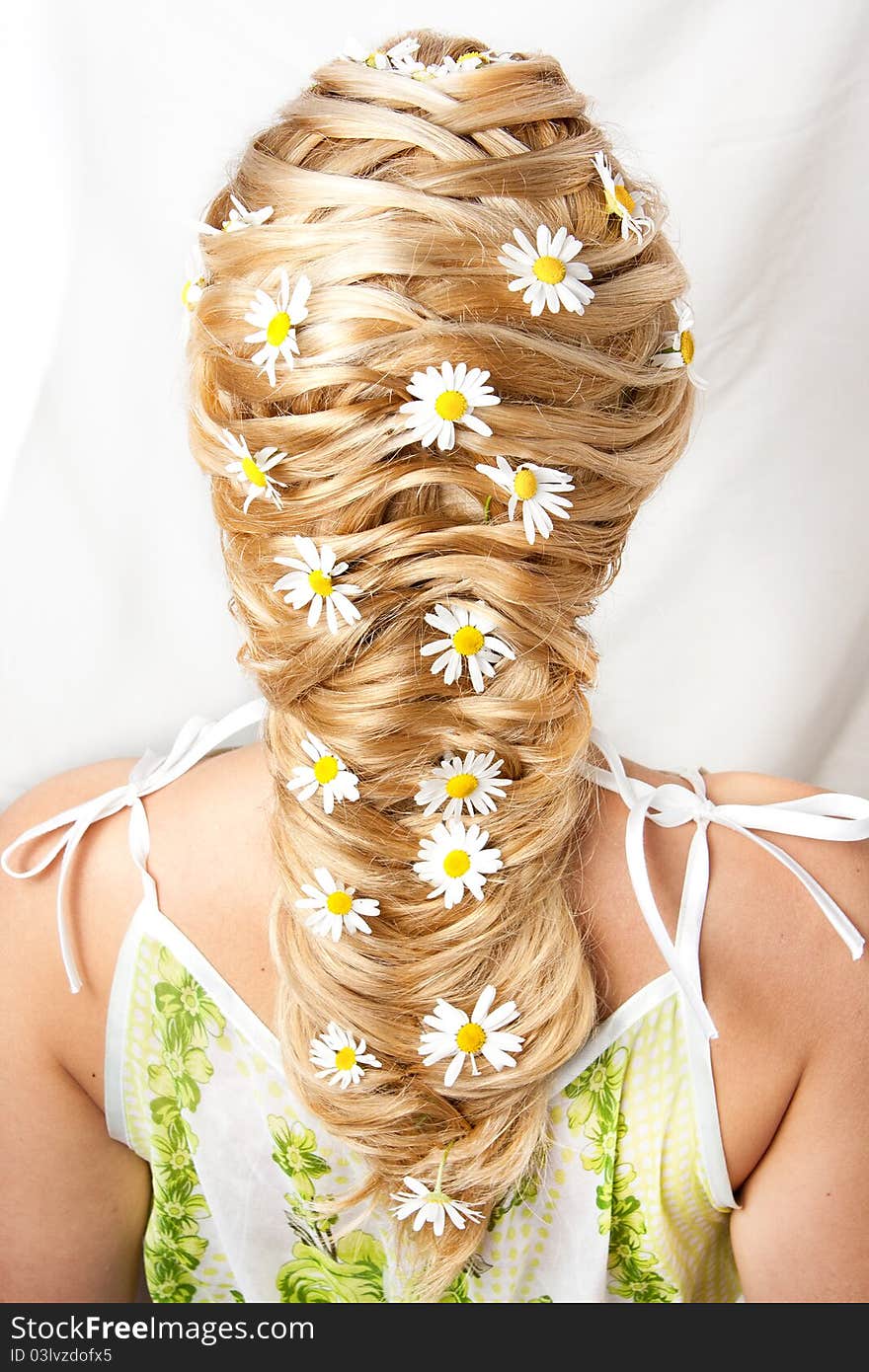 Flower hairdress of the girl on a white background