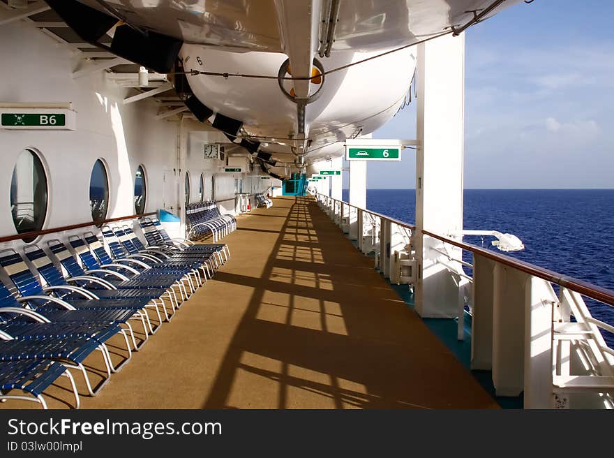 Empty lounge chairs tempt world weary passengers to find some peace and quiet and relax and soak up the Caribbean sun as they lay out in lounge chairs on the deck of Royal Caribbean's Serenades of the Seas. Empty lounge chairs tempt world weary passengers to find some peace and quiet and relax and soak up the Caribbean sun as they lay out in lounge chairs on the deck of Royal Caribbean's Serenades of the Seas.