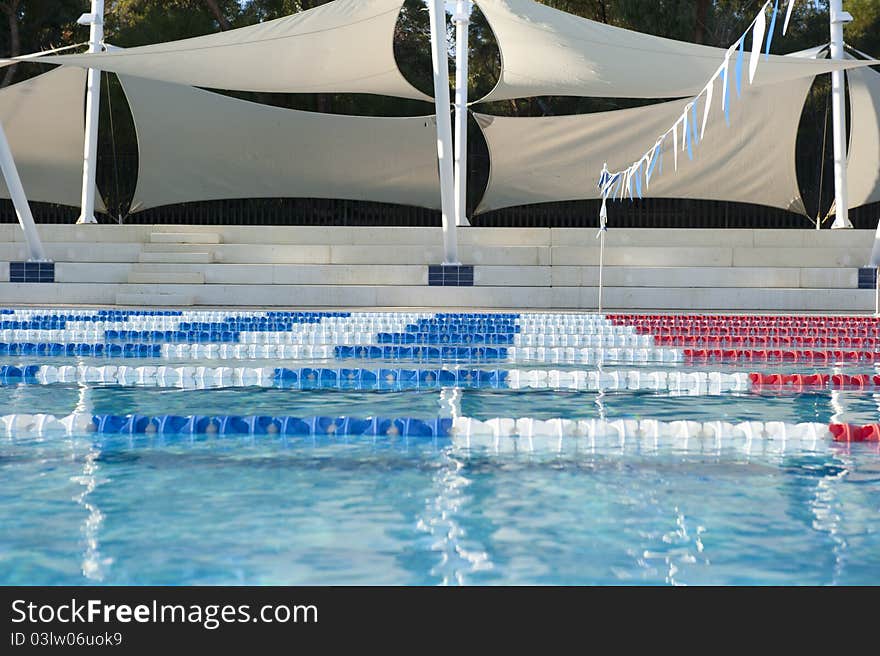 Empty lanes in a public swimming pool during the winter season.