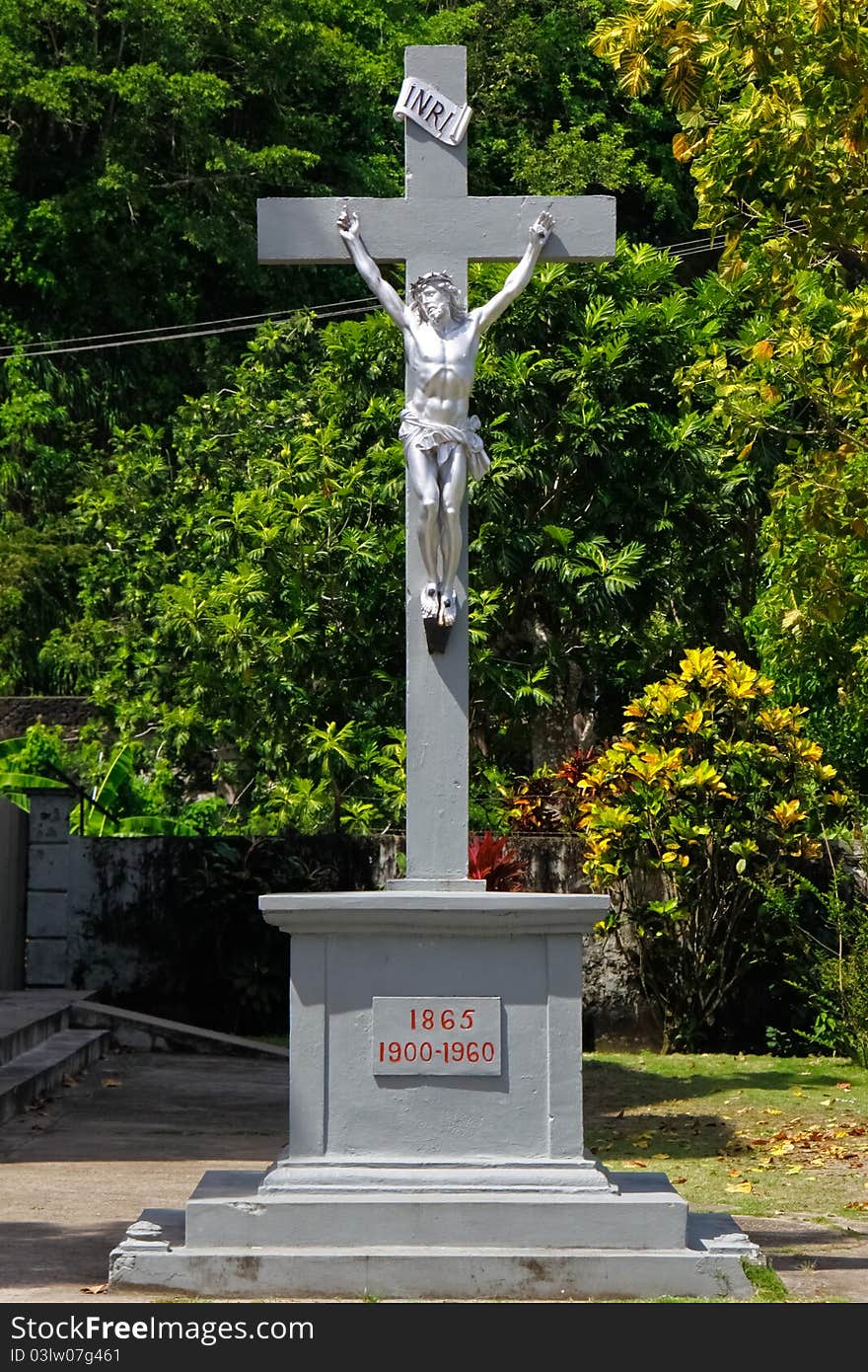 A depiction of Jesus Christ being crucified on a cross, all in silver, outside a Catholic Chucrh in the small fishing town of Anse La Raye on the Caribbean island of ASt. Lucia. A depiction of Jesus Christ being crucified on a cross, all in silver, outside a Catholic Chucrh in the small fishing town of Anse La Raye on the Caribbean island of ASt. Lucia.