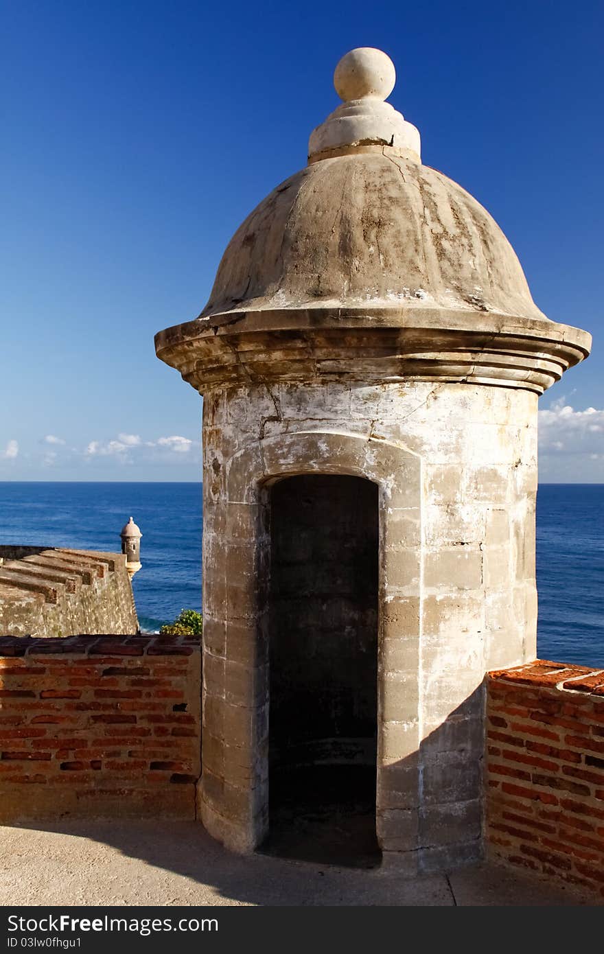 A beautiful view of a two guerites, or sentry boxes, along the coastal side of Fort San Cristobal in Old San Juan, Puerto Rico. Also known as Castillo de San Cristóbal, it was the largest fort ever built by the Spanish in the New World, designed to help protect San Juan from land based attacks. A beautiful view of a two guerites, or sentry boxes, along the coastal side of Fort San Cristobal in Old San Juan, Puerto Rico. Also known as Castillo de San Cristóbal, it was the largest fort ever built by the Spanish in the New World, designed to help protect San Juan from land based attacks.