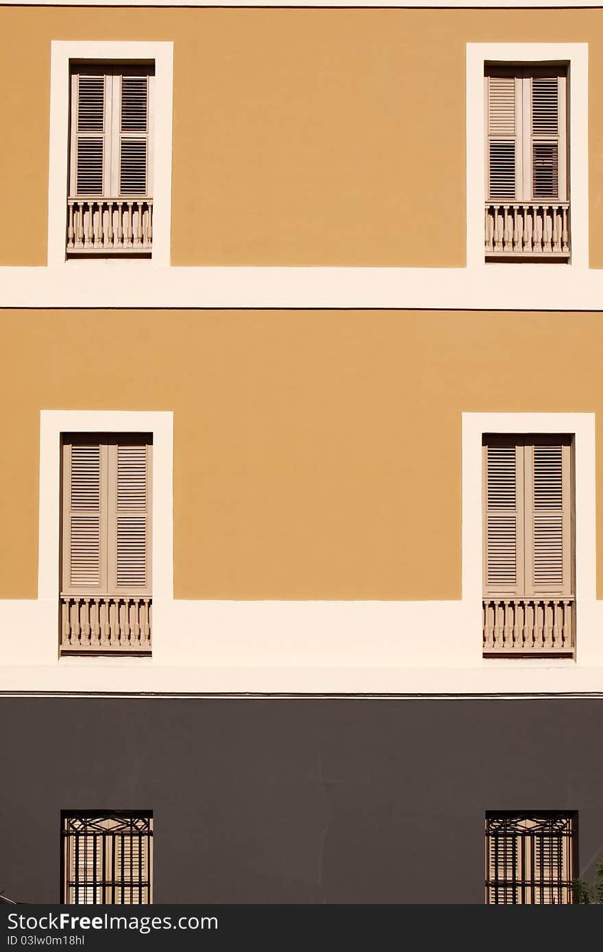 Tan, cream and brown earth tones help the window balconies of Ballaja Barracks really stand out, providing a beautiful view of Old San Juan architecture near El Morro Castle in Old San Juan, Puerto Rico. Colorful architecture and blue cobble stone streets are part of the charm of Old San Juan. Tan, cream and brown earth tones help the window balconies of Ballaja Barracks really stand out, providing a beautiful view of Old San Juan architecture near El Morro Castle in Old San Juan, Puerto Rico. Colorful architecture and blue cobble stone streets are part of the charm of Old San Juan.