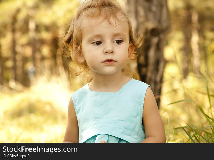 Cute little girl smiling in a park