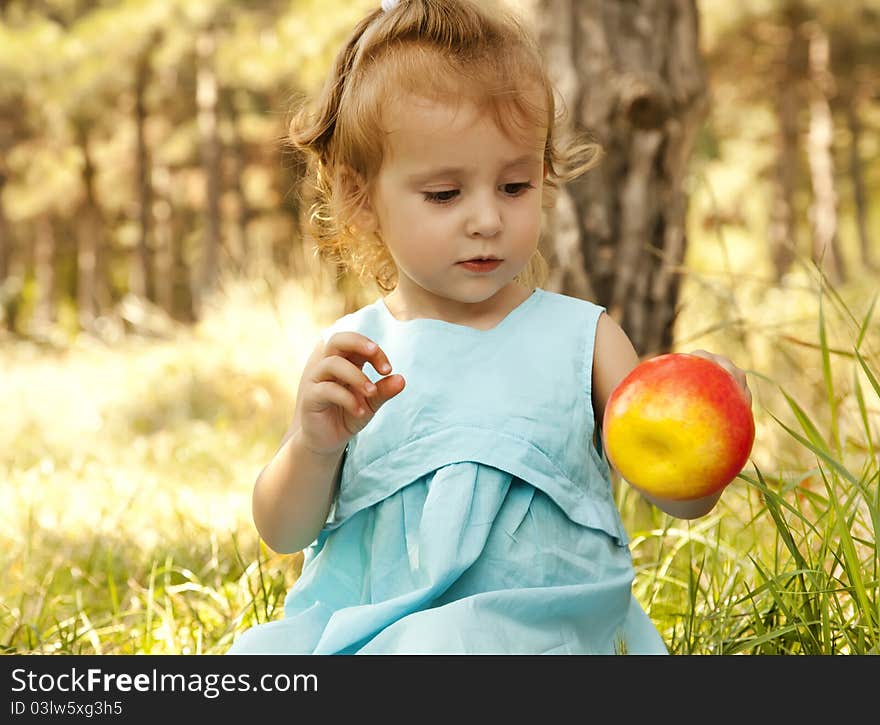 Cute little girl smiling in a park