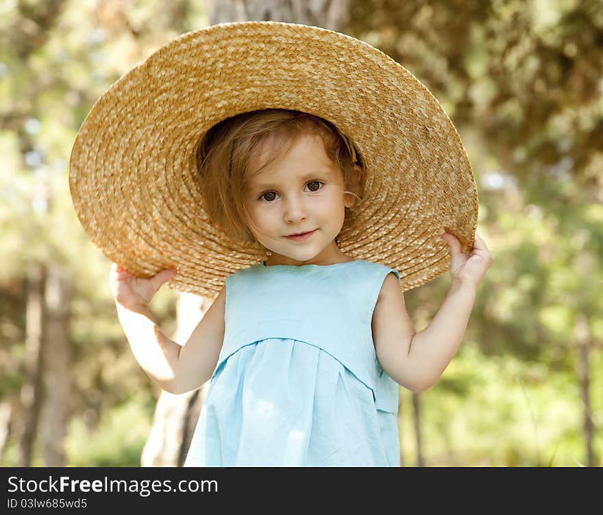 Cute little girl smiling in a park