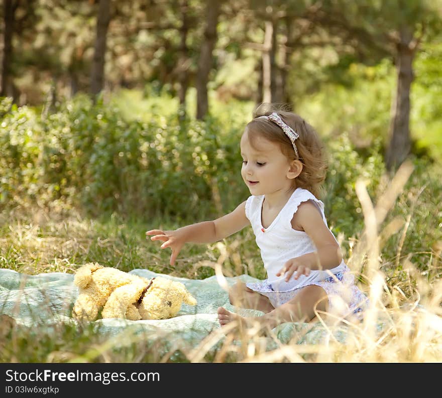 Cute Little Girl Smiling In A Park