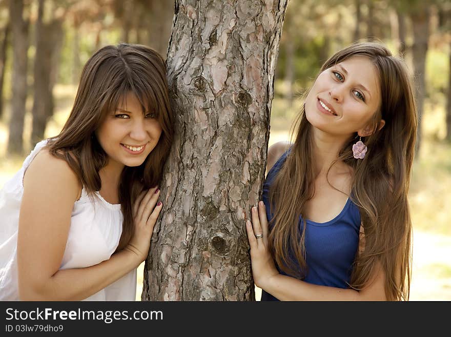 Two happy sisters at the park