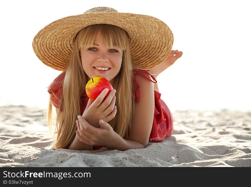 Beautiful girl in hat at beach