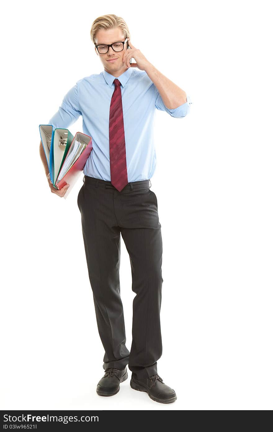 Businessman with mobile phone and folders. Businessman with mobile phone and folders