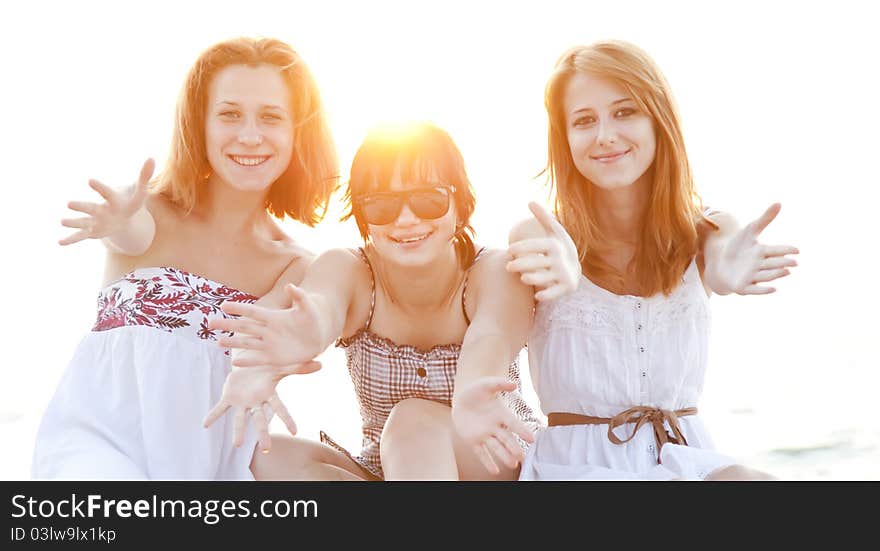 Portrait of three beautiful girls at the beach.