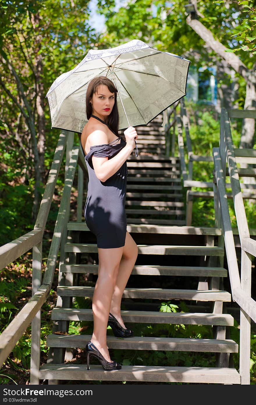 Beautiful young sexy brunette girl in the park