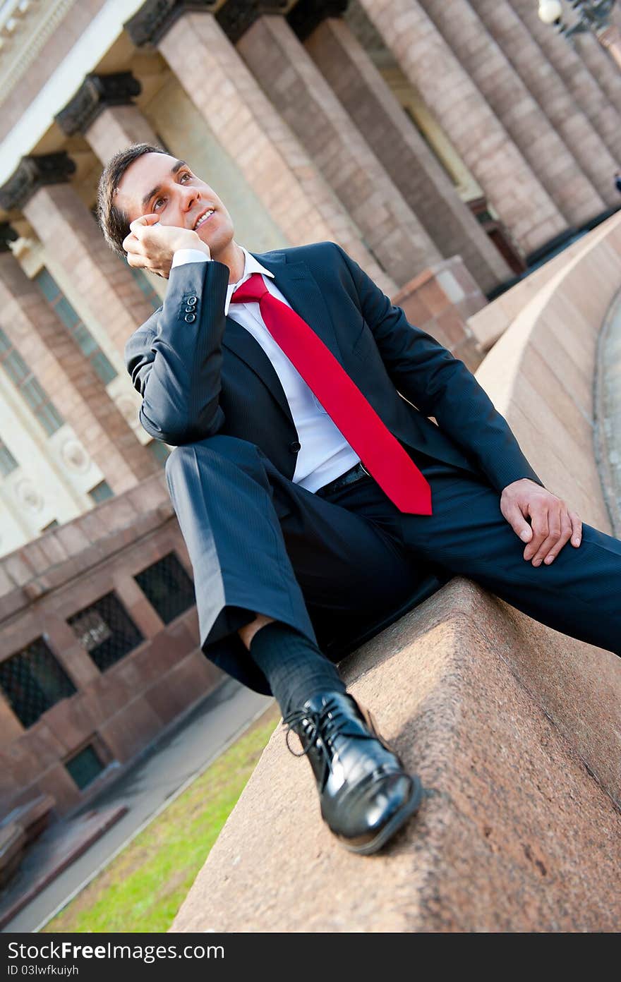 Young successful businessman portrait in modern downtown. Young successful businessman portrait in modern downtown