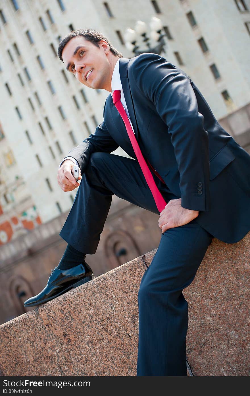 Young successful businessman portrait in modern downtown. Young successful businessman portrait in modern downtown