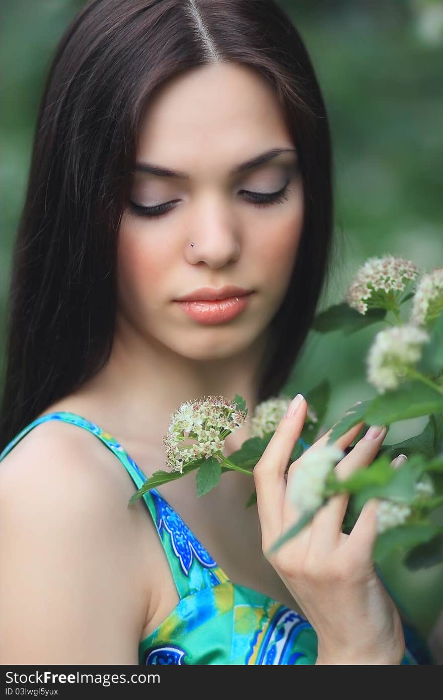 Beautiful girl over nature background.