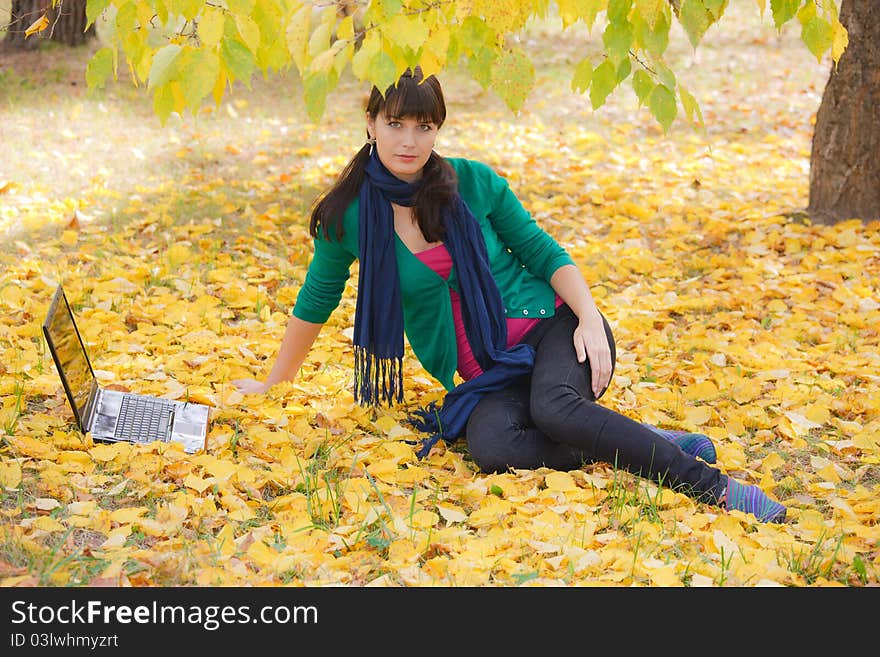 Autumn landscape. beautiful young girl resting in yellow autumn leaves. Autumn landscape. beautiful young girl resting in yellow autumn leaves