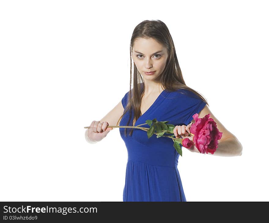 Girl standing with flower in hands and looking ahead. Girl standing with flower in hands and looking ahead