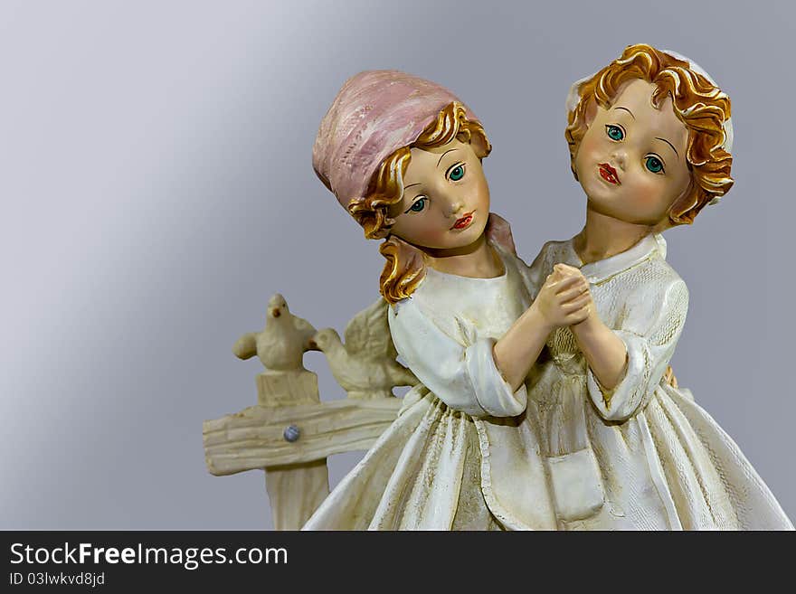 Picture of porcelain figure two sisters dancing. Isolated.