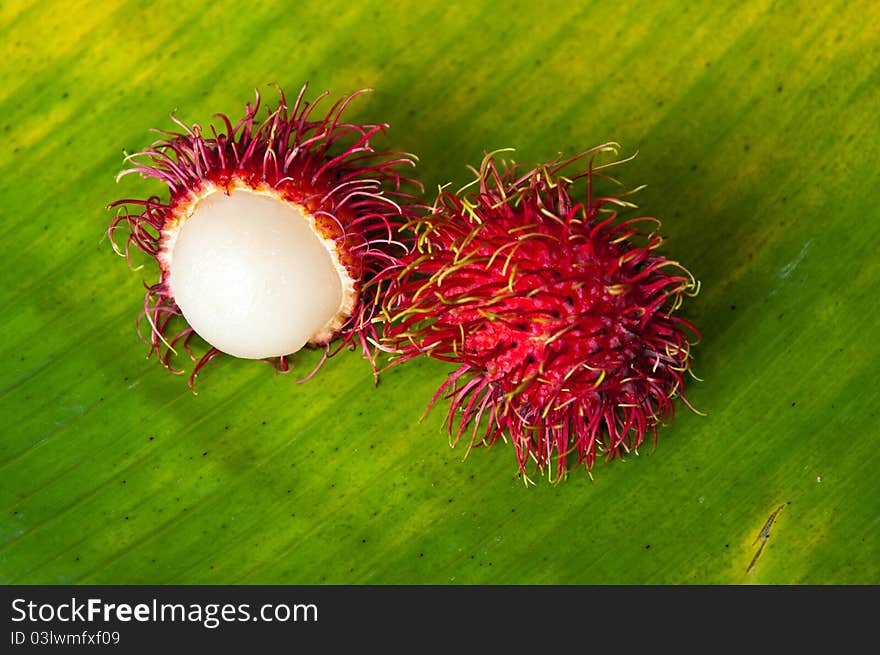 Rabbutan on green banana leaf. Rabbutan on green banana leaf