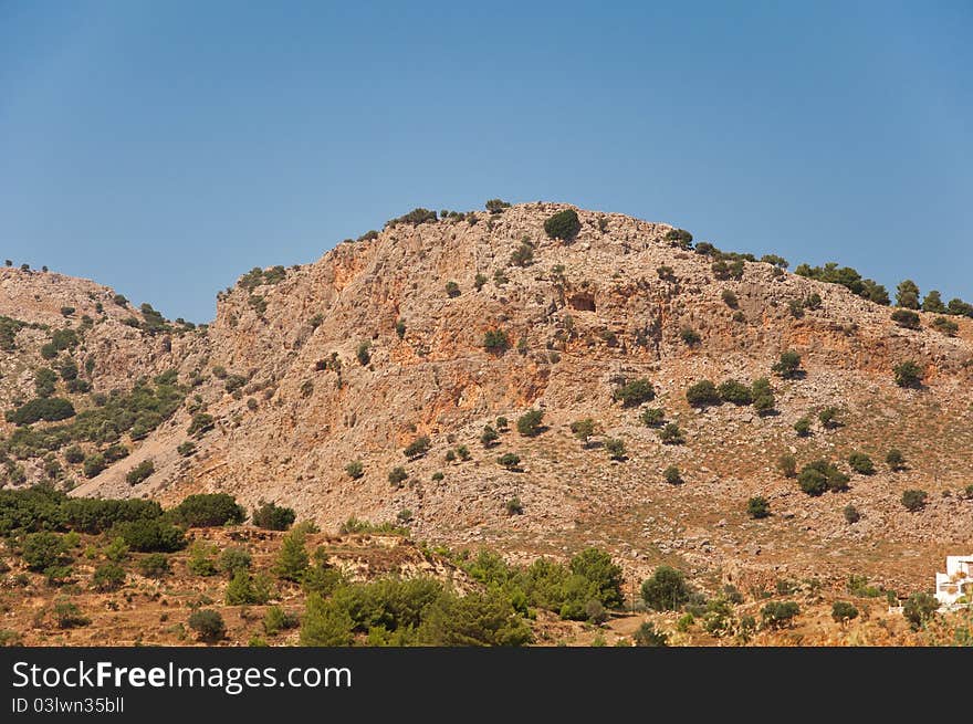 Typically hill of dry coastal regions, Rhodes, Greece. Typically hill of dry coastal regions, Rhodes, Greece