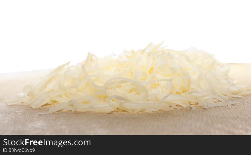 Grated cheese isolated on white