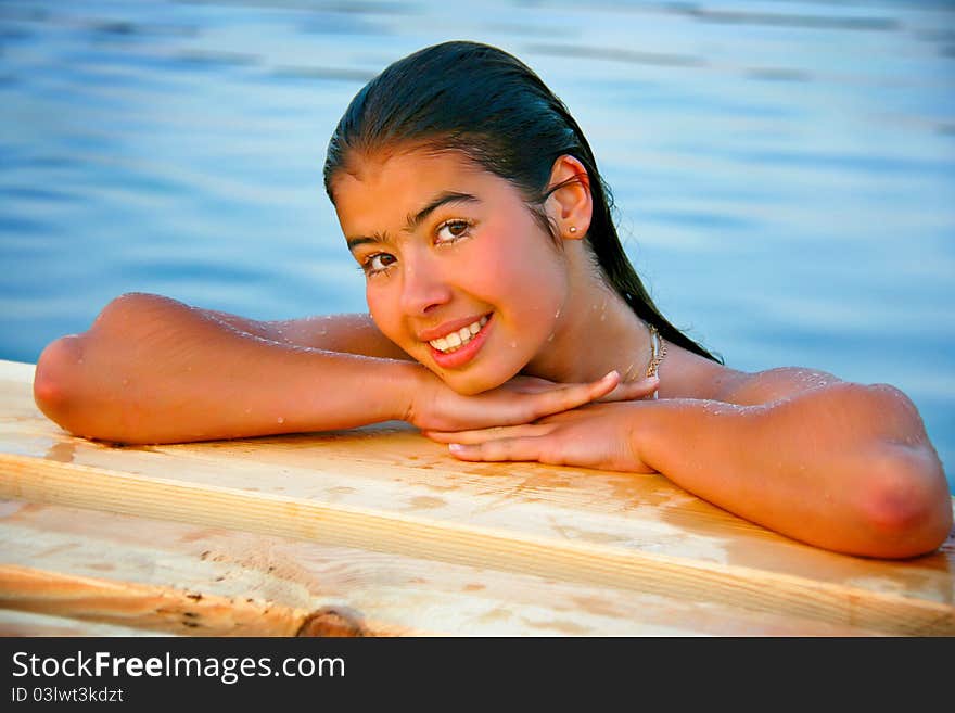 Head girl with wet hair lying on the hands