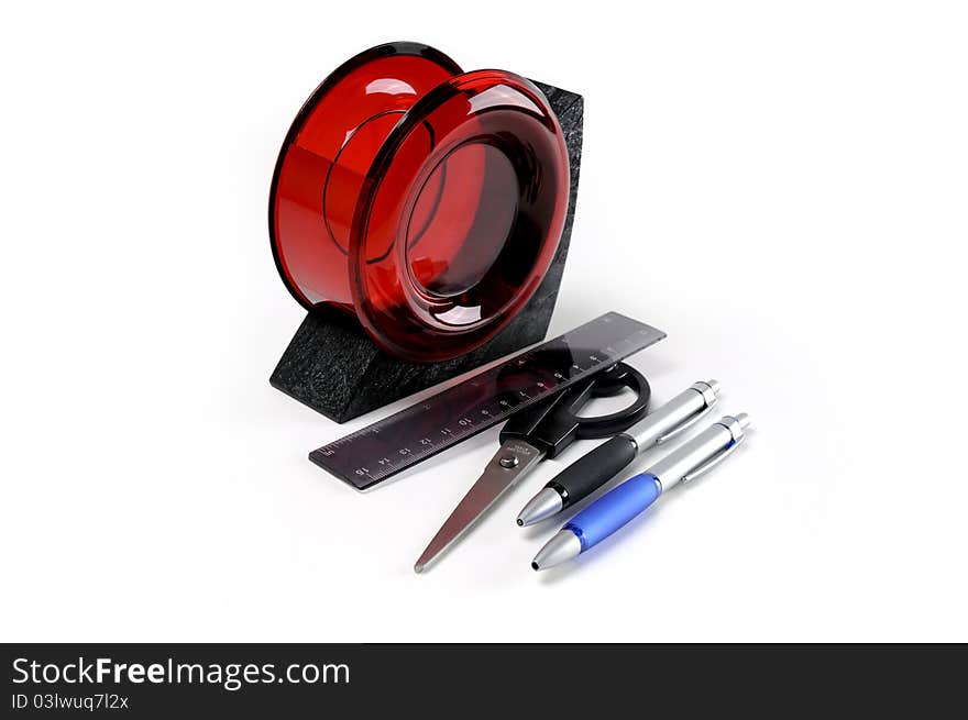 Black and red plastic desk organizer with office tools