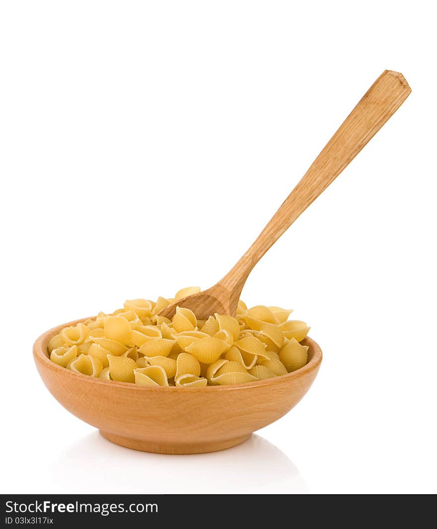 Raw pasta and wooden spoon