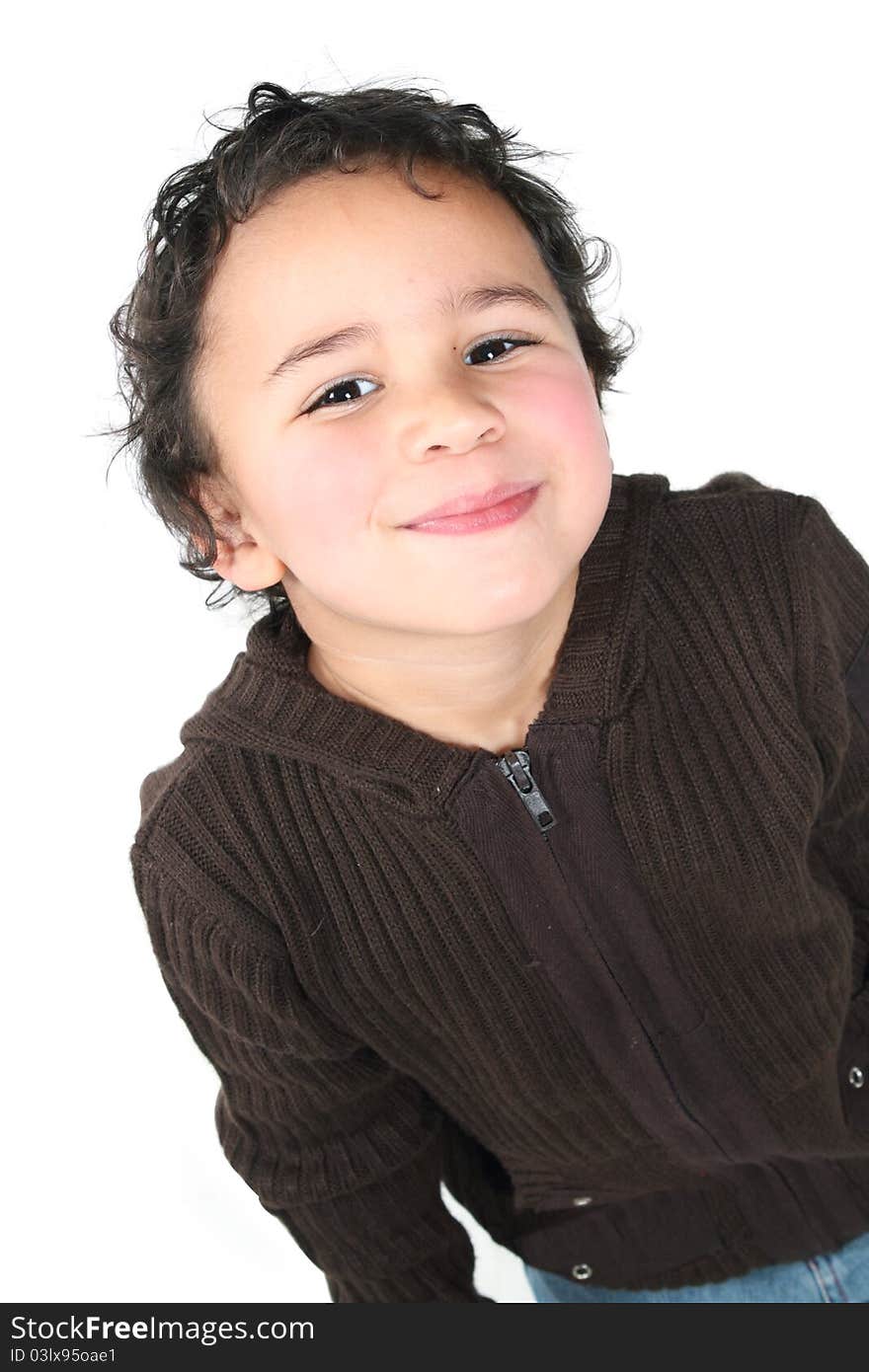 Cute little boy smiling on a white background