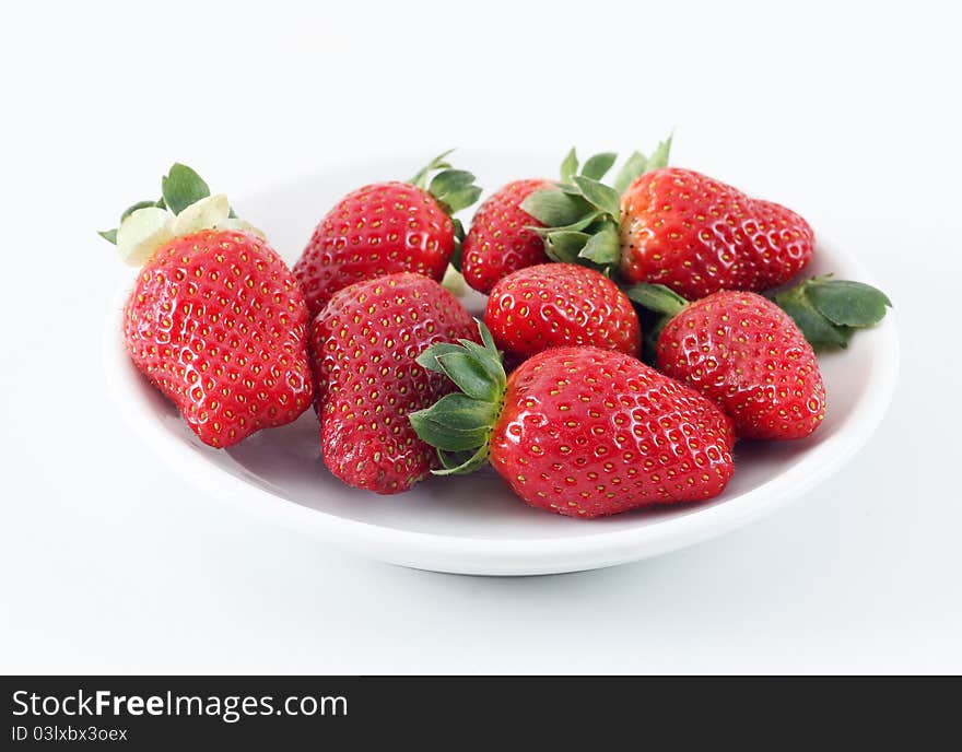 Group of strawberry on white plate