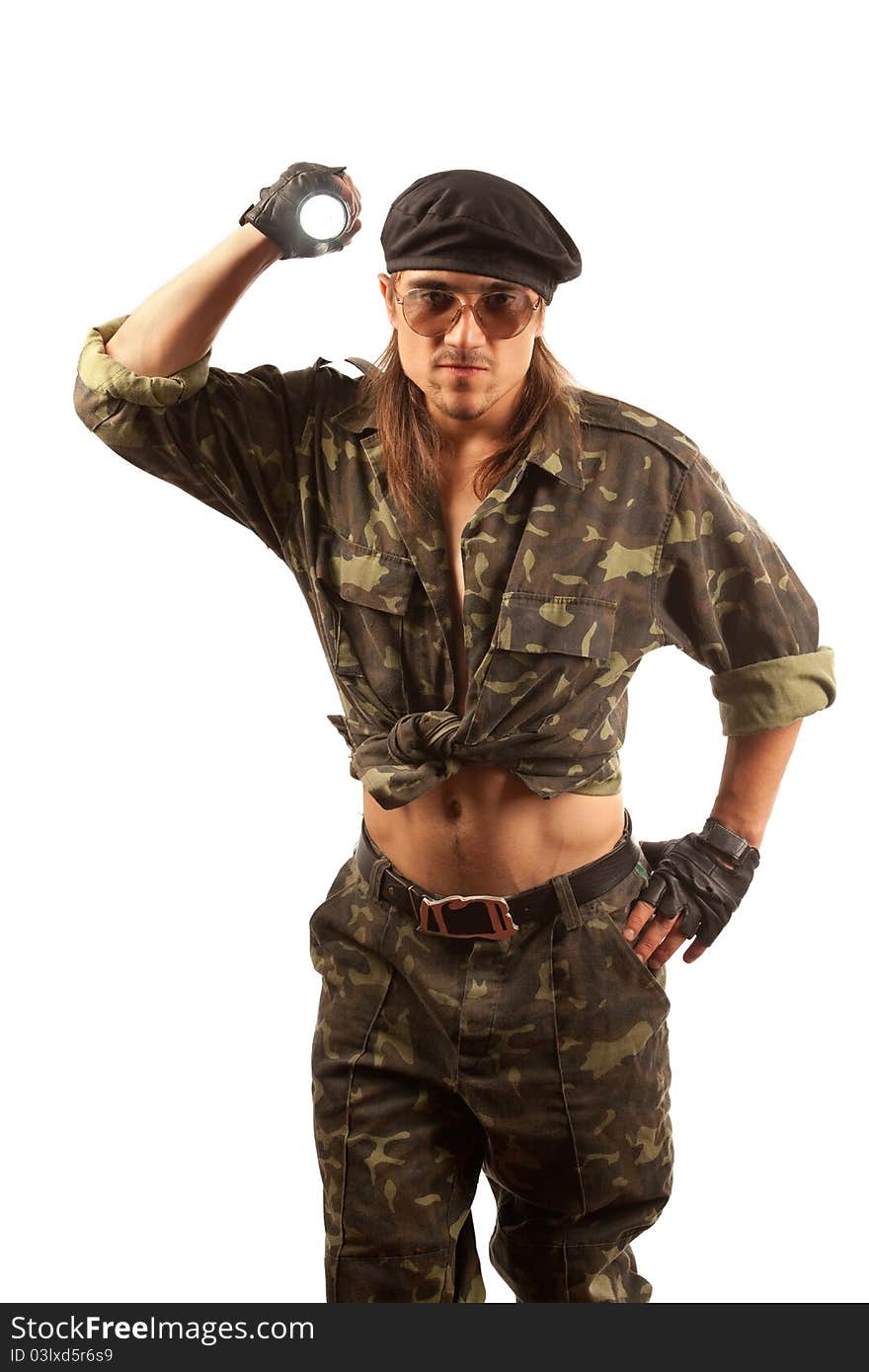 Soldier with flashligh. Studio shot over white background.