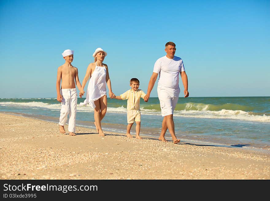 Family walking along the beach