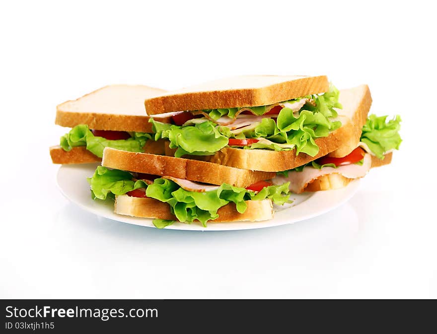 Tasty sandwiches on the plate isolated over white background