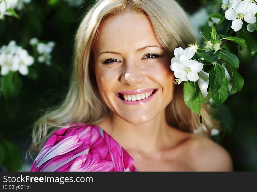 Girl on a background of white flowers