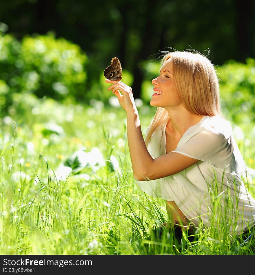 Woman Playing With A Butterfly