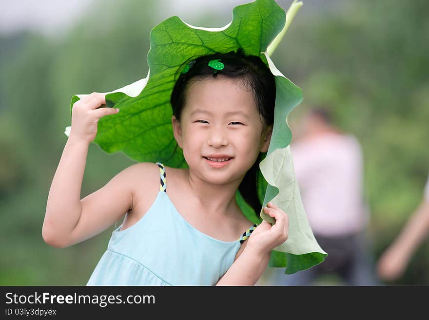 Chinese girl with lotus leaf hat,wuxi ,china