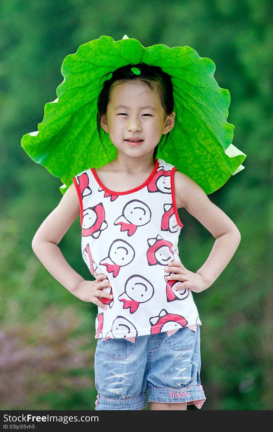 Chinese girl with lotus leaf hat