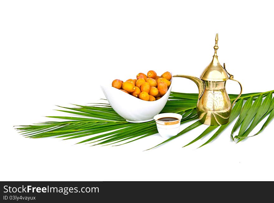 Arabic coffee pot with date fruits