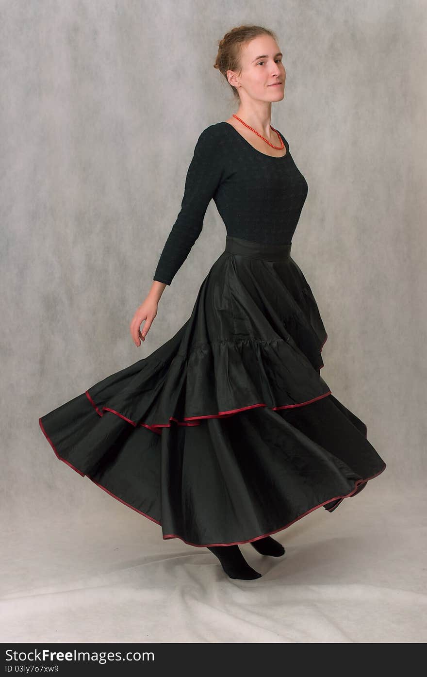 Dancing girl in long black skirt go round. Dancing girl in long black skirt go round